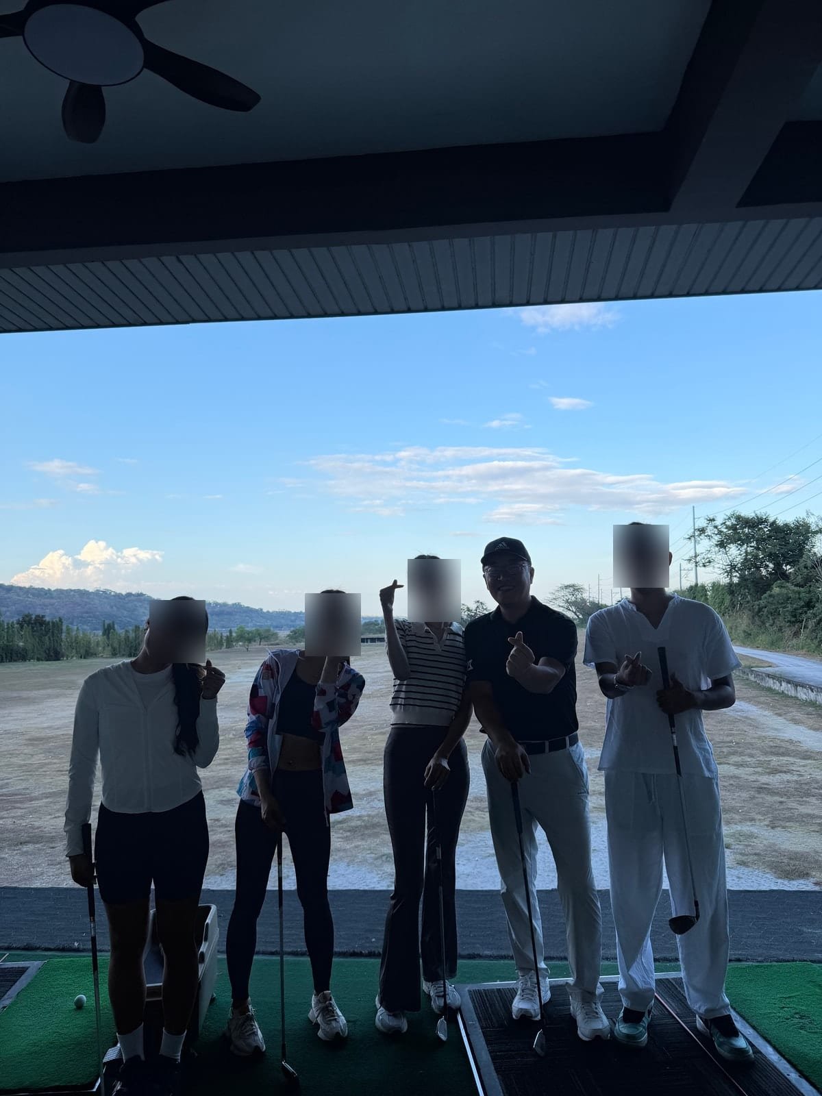 Students and the teaching pro after a golf lesson
